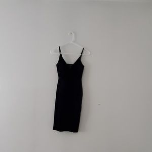 Selling a short, velvety, black dress